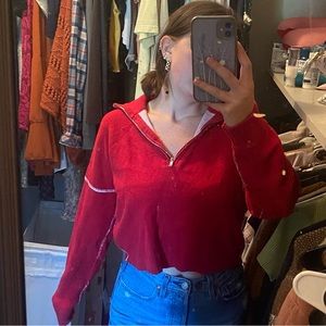 Red quarter zip sweatshirt.